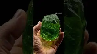 Natural Moldavite gemstone chunk, rough surface texture
