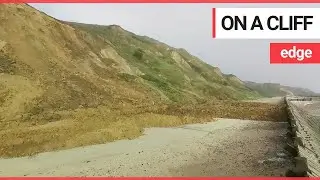 Dramatic footage shows huge landslide on a quiet beach | SWNS TV