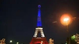 Red,white, blue Eiffel Tower in homage to Nice attack victims