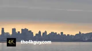 4K UHD - Beautiful cityscape with sunset light glowing under clouds