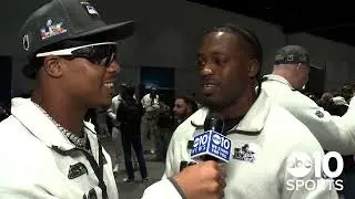 Seattle Seahawks linebacker Chris Paul Jr interviews Jamie Sheriff during Super Bowl Opening Night