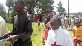 Blessings the church compound with Holy water 
