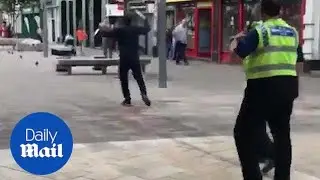 Knife-wielding man is wrestled to the ground by police in Hull