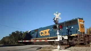 CSX Fast Moving Rock Train Through Railroad Crossing
