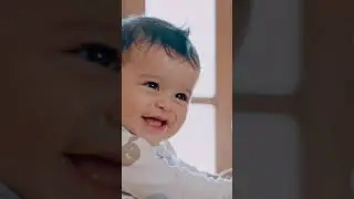 Close up to the face of a small baby with big eyes