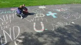Spreading positive messages through chalk art