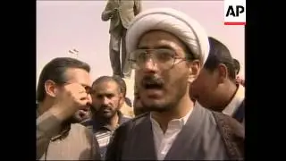 Protestors attack statue of Baath Party founder