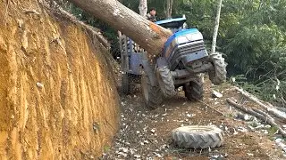 &ldquo;Dangerous Logging Route: Agricultural Vehicle Struggles on Cliffside Road&rdquo;