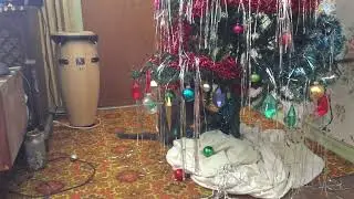 Henry helps take down the Xmas tree 