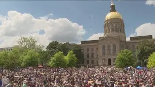 Thousands rally in Atlanta to protest efforts by Trump, Musk
