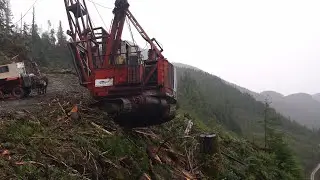 Grapple yarder rolls off road