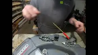 Lubricating new Flex Shaft 102 cable and installing chain knocker. 20