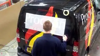 Application of Vinyl lettering graphics to commercial vehicle