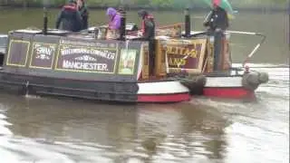 Canal boats leaving Latchford Locks on the Manchester ship canal