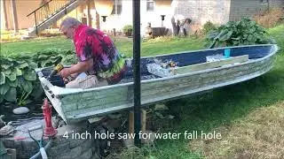 Koi Pond gets a Boat feature water fall and fish habitat
