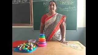 Stringing / Threading the beads activity for LKG