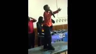 Mc Tsotso performing on top of the table