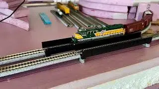 N scale train layout run with terrain loop