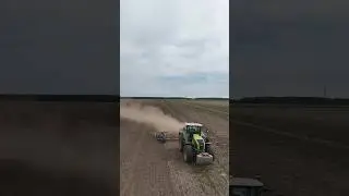 CLAAS AXION 930 mit einer K&Ouml;CKERLING REBELL Scheibenegge