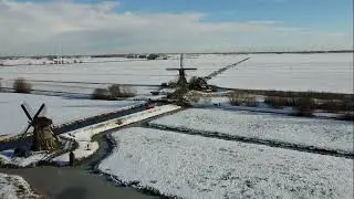 Dutch mills in a winter landscape