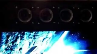 THHGTTG a speaker stack rising like a shear cliff face
