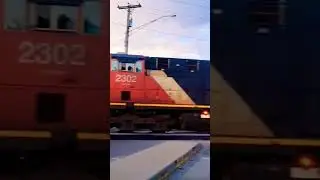 Fast CN Freight Train Flying Through Plainfield