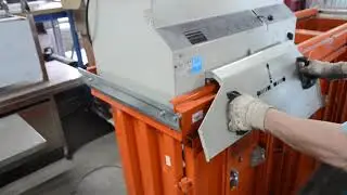 Orwak 5070 triple-chamber press baler in operation