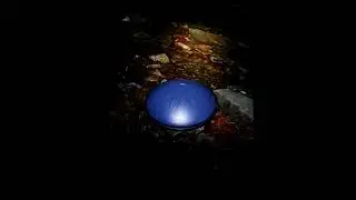 Mountain stream with tonque drum in night
