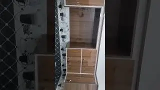 beautiful ketchen desing in wood colour and gloss sheets with owen space and drawer space