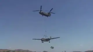 Helicopter lifting airplane!