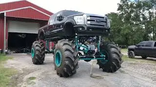 Painting the bottoms of 2 mega trucks mud trucks. 5 tons and Axletech 4000s finished for Ironhorse