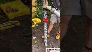 The process of driving ground screws in the courtyard