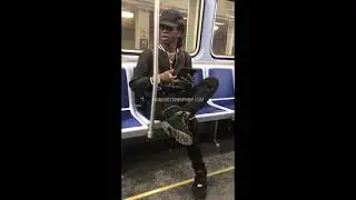 Offset look a like on train wearing fake Gucci and chainz