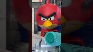 I see this Angry Birds red Bird ￼speaker on the window at the New York City souvenir shop ￼