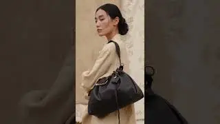 Song of the Wind, Summer 2025, featuring the Medium Gather Bag in onyx Nappa leather