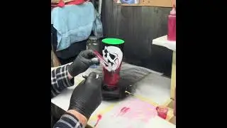 Painting red fire on a 30oz stainless steel tumbler 