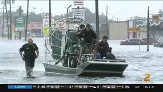 Crews work to rescue people from rising flood waters in Florida
