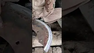 Hammering The Old Iron Cutter After Making It Warm in Fire By Black Smith