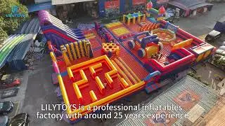 Orange-Red Carnival Inflatable Adventure Park: Giant Maze & Slide Fun for All!