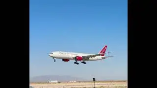 Omni Air International Boeing 777 landing