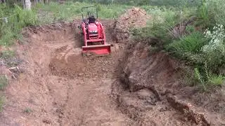 See  How HARD It Is To Dig Freshly Exposed Lamproite Ore With The Front Bucket Of A Kubota Tractor