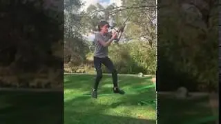 Person swings around a tree on a cable and barely makes it to the other side.