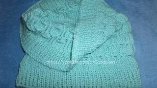Child Scarf snod. A knitted scarf is a yoke, a pipe. Knitting with knitting needles.