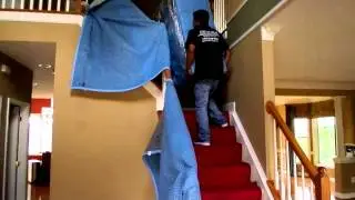 Moving Tips D.C - Pro movers carry a dresser