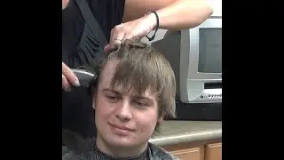 Boy getting a short haircut [22L23D]