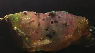 Play of color in opal in support of the tune 