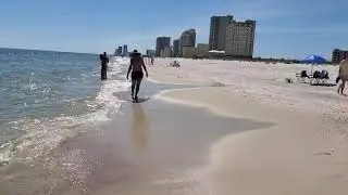 Walking along the shore at Gulf Shores Public Beach