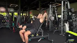 Back supported barbell overhead tricep extension