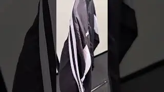 Close up on the detail on our black and white shell suit