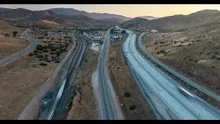 Drone Hyperlapse at Dusk Of Antelope Valley, the 14 Freeway, and SoCal Train